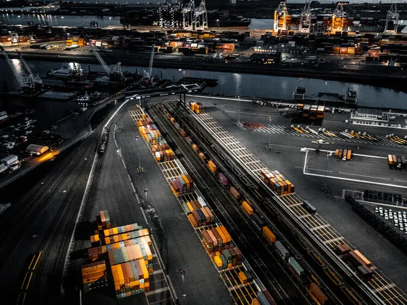 Container terminal and intermodal rail yard operating under lights at night